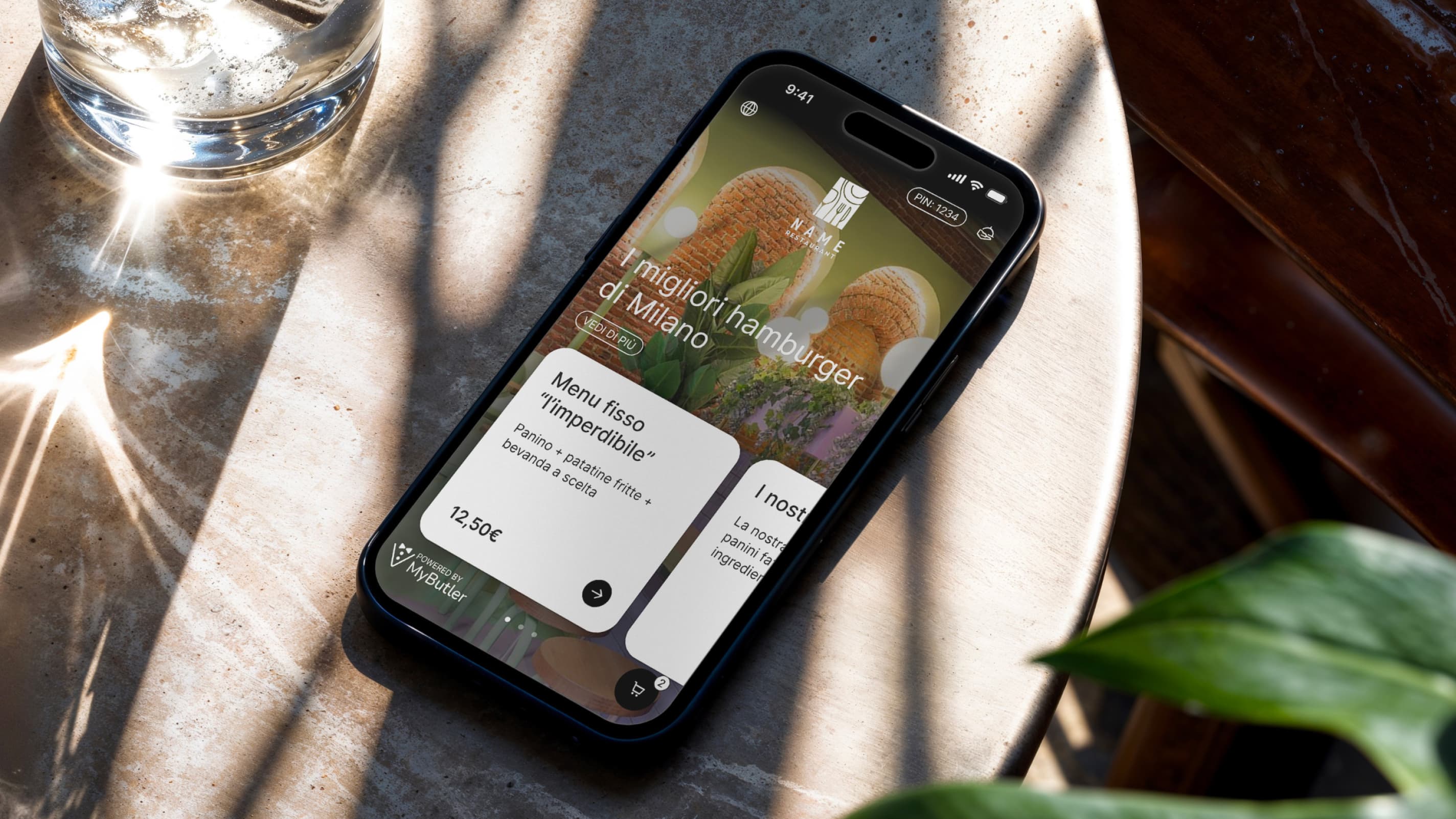 A mockup inside an elegant restaurant, showing the homepage of MyButler application